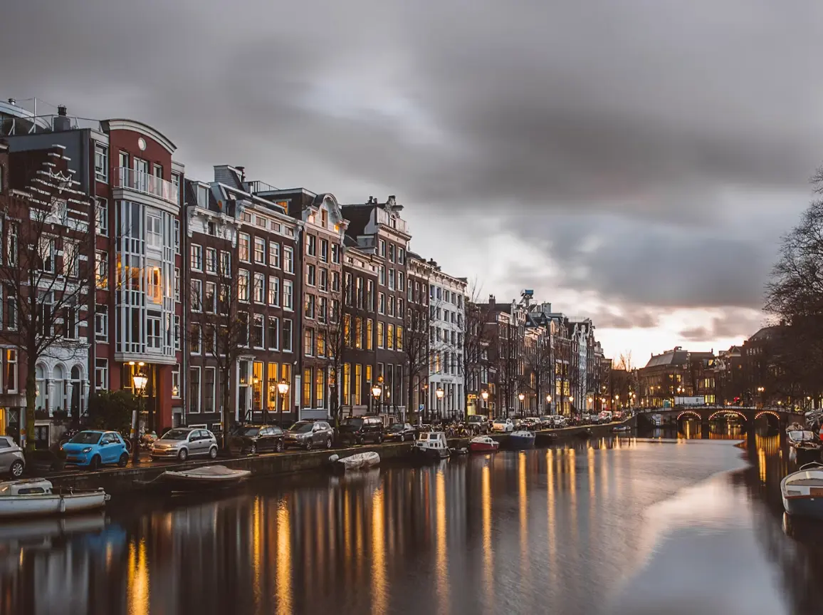 A cityscape of Amsterdam, representing Virtani's comprehensive business, payroll, and Employer of Record services in the Netherlands.